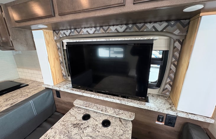 Motorized TV that raises and lowers.