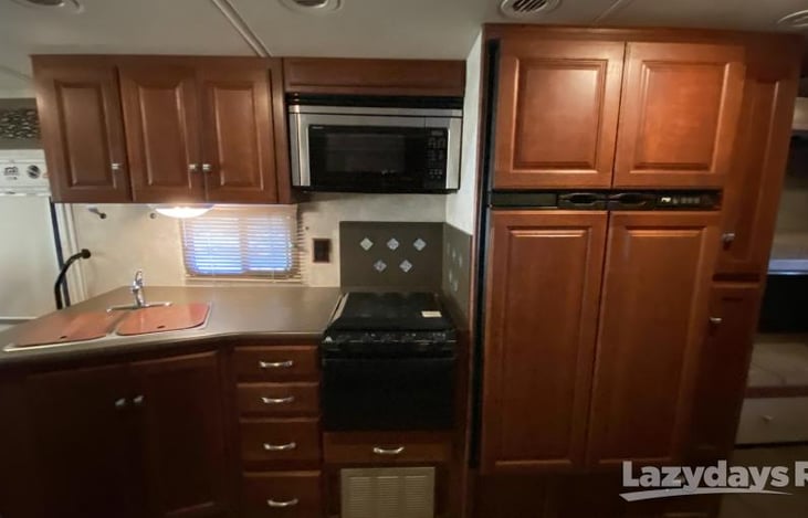 Kitchen area with  Microwave and confection oven combo