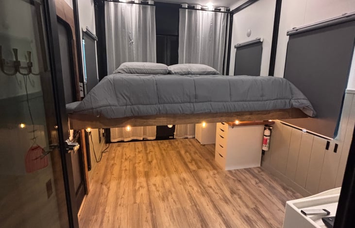 The master bed is a king and is on a Happy Jack system that go up and down- allowing the bed to be up and out of the way during the day - making the room a great office space.