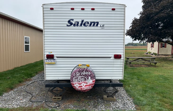 Spare tire there is a crowbar located in the rear compartment you can drive up on the chocks and fix your own flat hopefully not