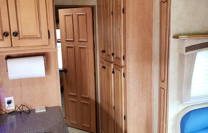 Hallway to bunk room with pantries