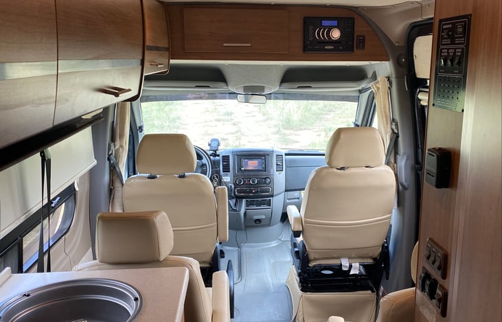 The comfortable captain chairs and openness of our Sprinter make traveling enjoyable