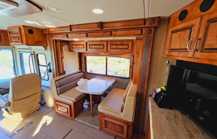 Dinette folds to single bed with bedding and accessories