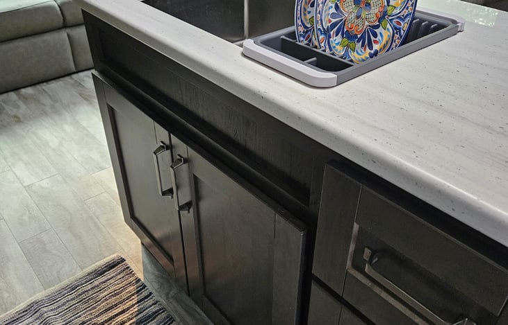 Sink, lots of storage for pots, pans and kitchen items