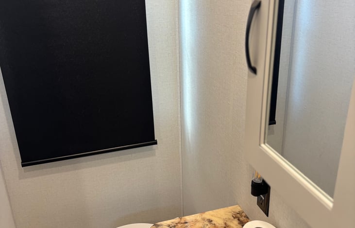 Bathroom #2 has toilet, sink, and shower