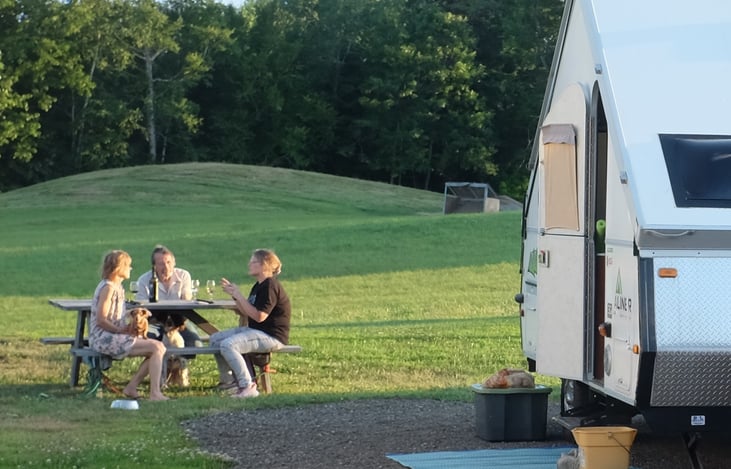 Wine with friends at a Harvest Host Site in Maine