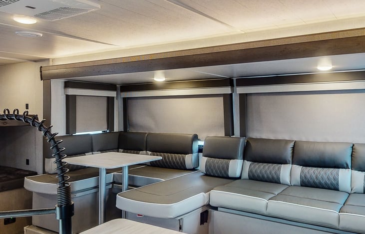 Close up of living and dining area. Seating can be adjusted.