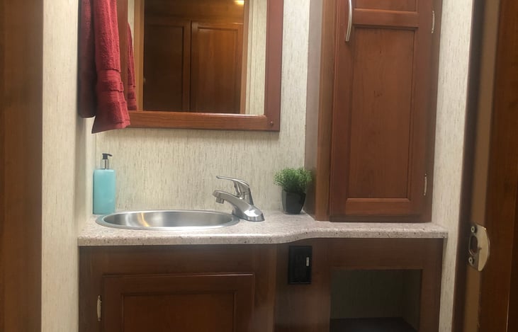 Half bath with storage space for toiletries