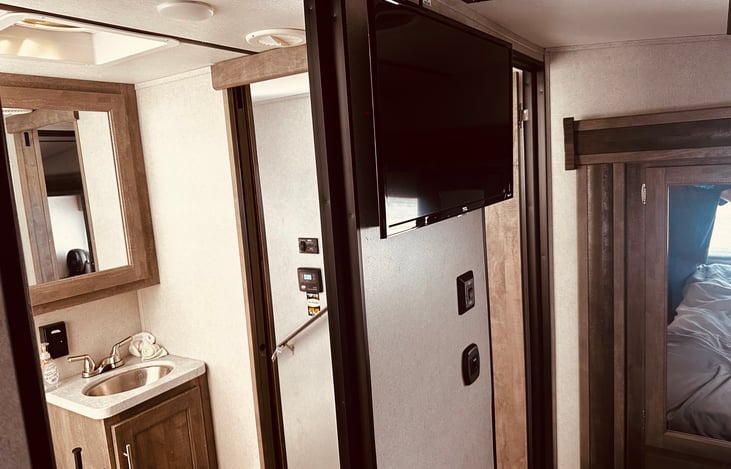 Master room with private bathroom and tv