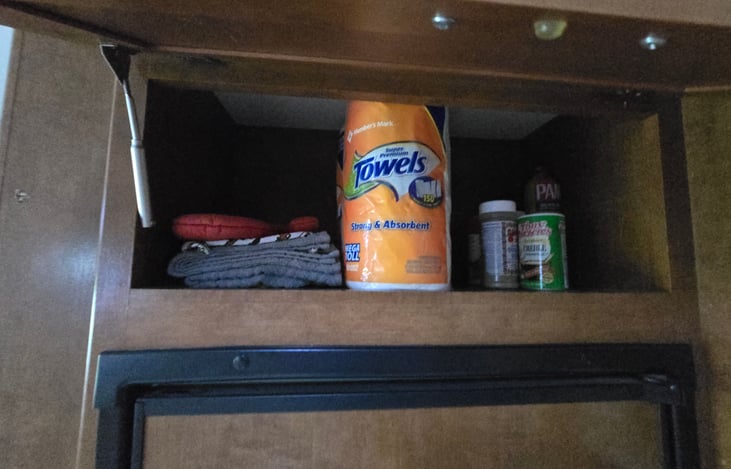 Fully stocked with extra paper towels, pot holders and some of our favorite seasonings