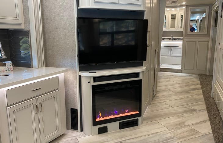 TV and fireplace. Fireplace has a fan unit and can be used for additional  heat source.