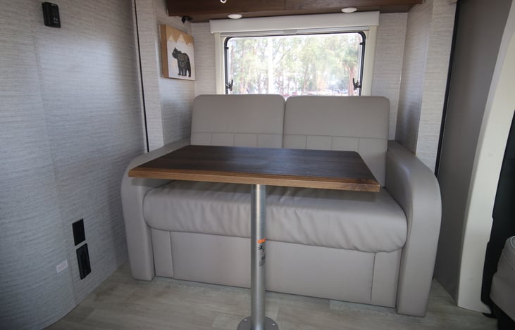 Table can be removed and placed in front of the rotating driver and passenger seats.