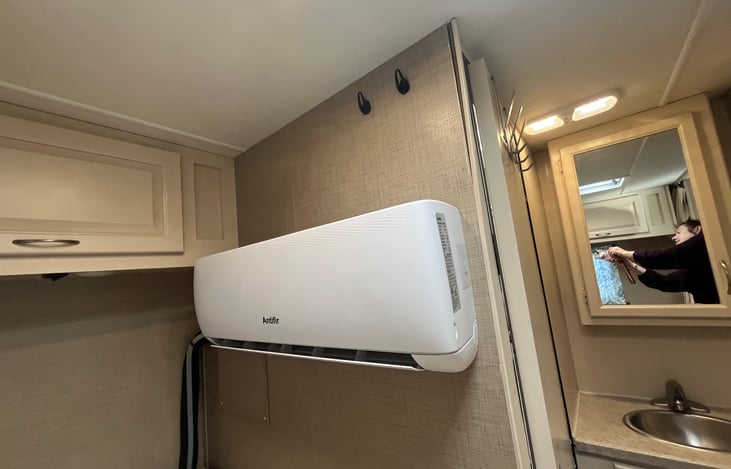 Air conditioning and heat exchange unit - uses electricity only - not required to use propane for temperatures down to 40⁰ Fahrenheit. MUCH quieter and more effective air con than traditional units