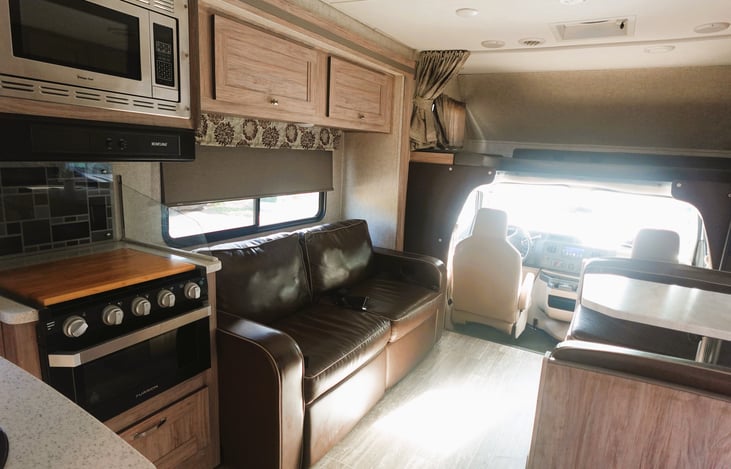 big comfy sofa has stow away seat belts. has 2 seat recliners and is a sleeper sofa.