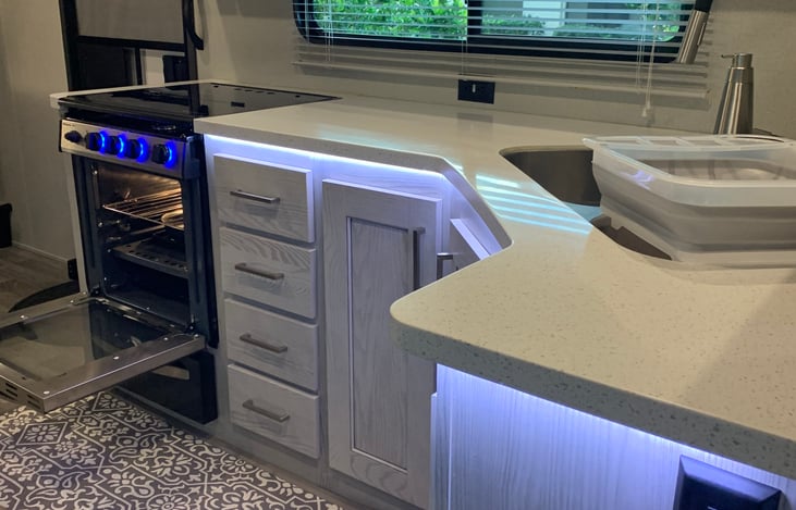 Three burner stove top and oven. Kitchen is fully supplied with flatware and dishware for 6 people.