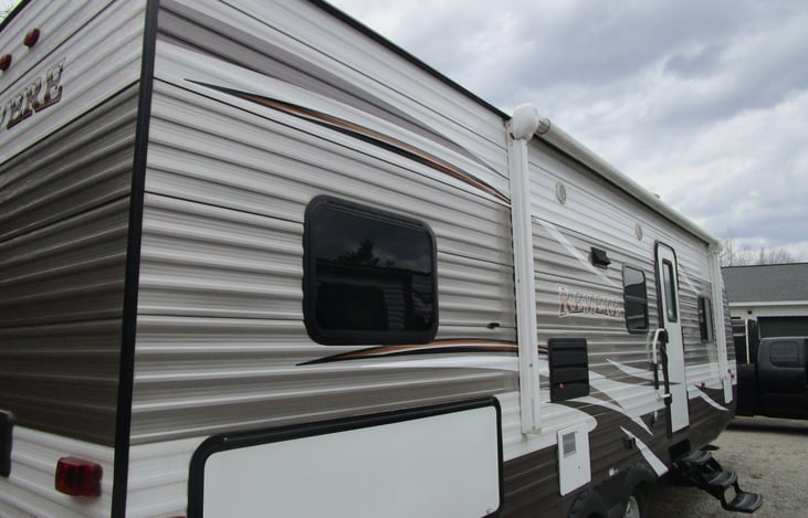 Entrance side with awning.