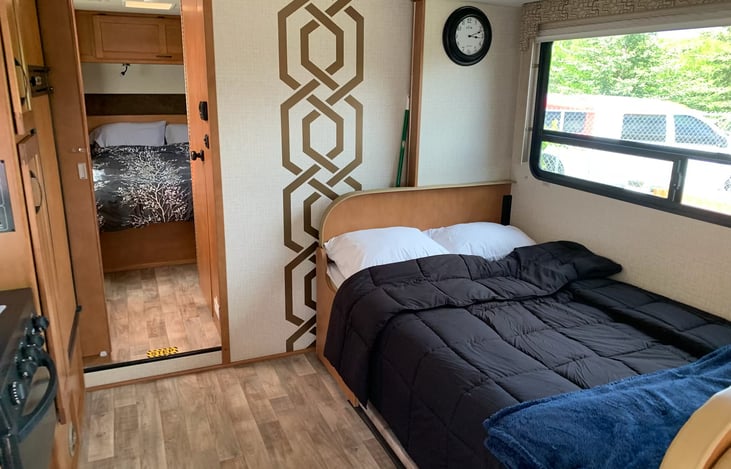 Main Dinette makes into a comfy bed for 2.  Just lift the table out and take the table stand out and plop the top in for the bed and cushions right on top. :)
My favorite thing is how spacious!