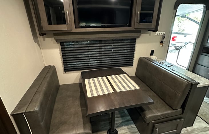 The kitchen table turns into a bed that could fit 1-2.