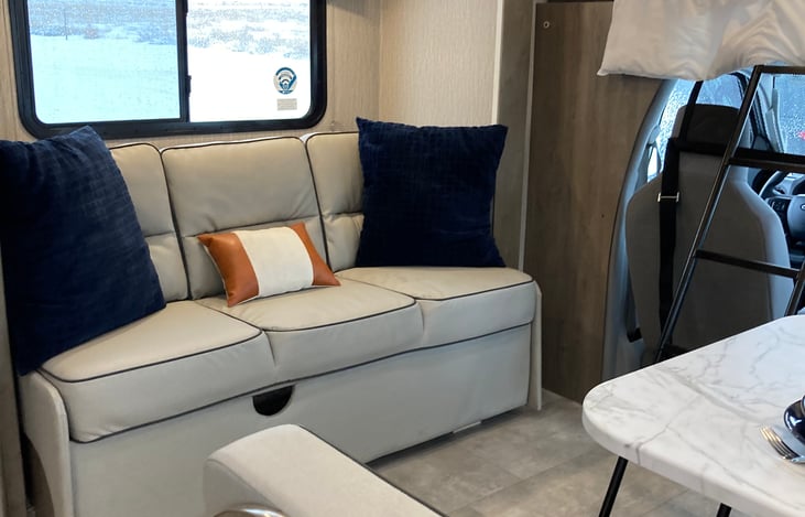 Couch in living area makes into a bed.