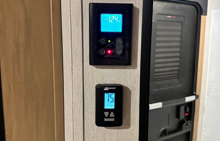 Water heater and thermostat panels