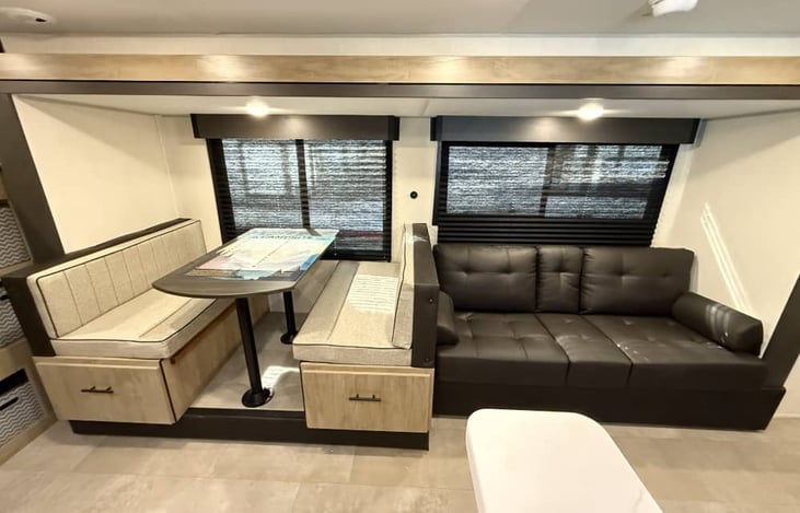 Living room with sofa bed and dinette