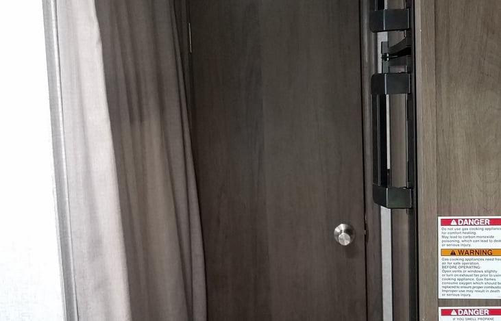 Door to Bathroom in Rear