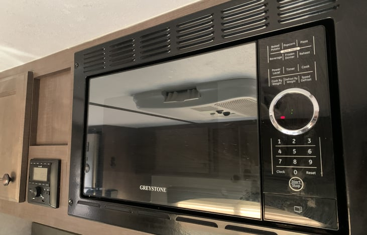 Small microwave for easy meals or microwave popcorn.