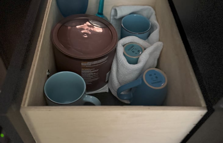 Cups and coffee safely in a big draw