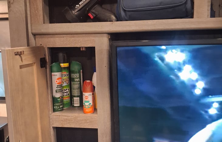 There is a spot light and flash light to light your way. There's also bug spray and sun blocker lotion.