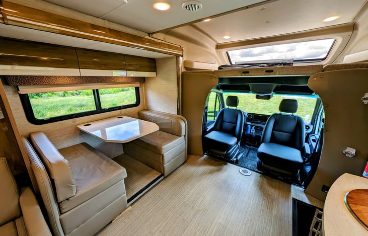 Dinette - and cabin chairs that swivel giving you extra seating! (Extra table is stowed)