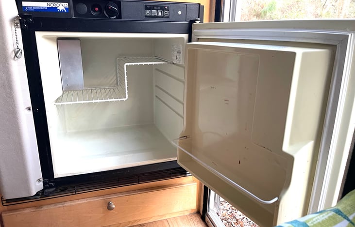 Mini fridge to keep your food cold and fresh so you don't need to get groceries as often.