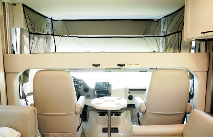 guest bed fully deployed (push buttons) over the captains chairs.