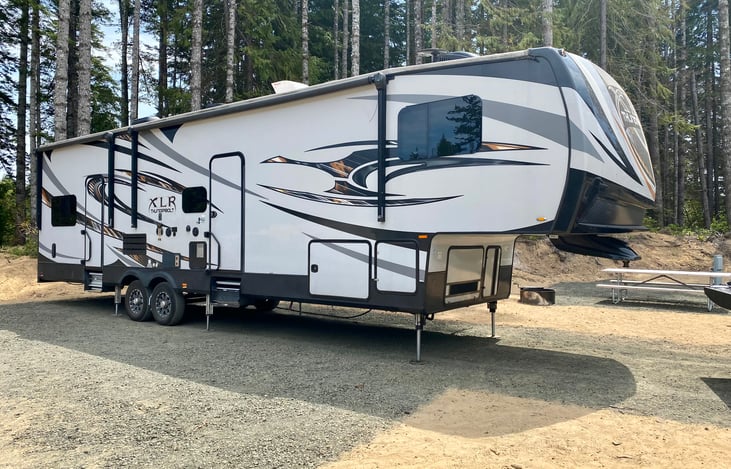 Sleek modern exterior with LED lit awnings, plenty of storage & exterior speakers.