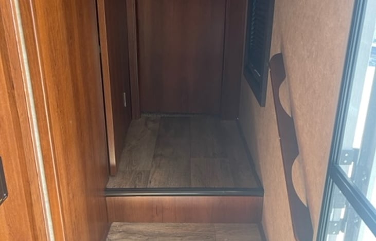 Steps into bathroom and bedroom area.