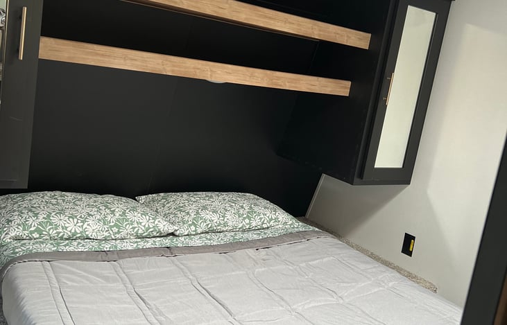 Master Bed with his/her storage cabinets, and plenty of space for storage under as well as above.