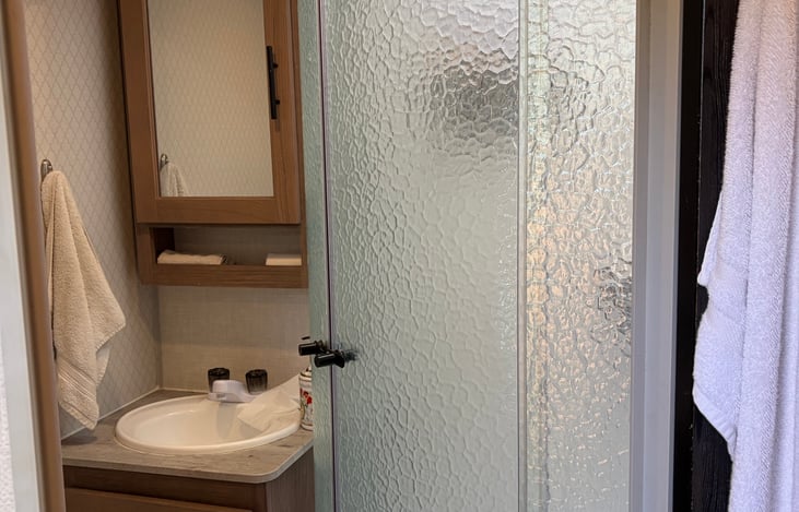 Bathroom with sink, toilet and shower
