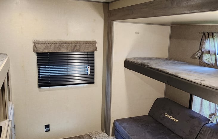 Another bunk bed, with the couch below able to be turned into almost a full-size bed.