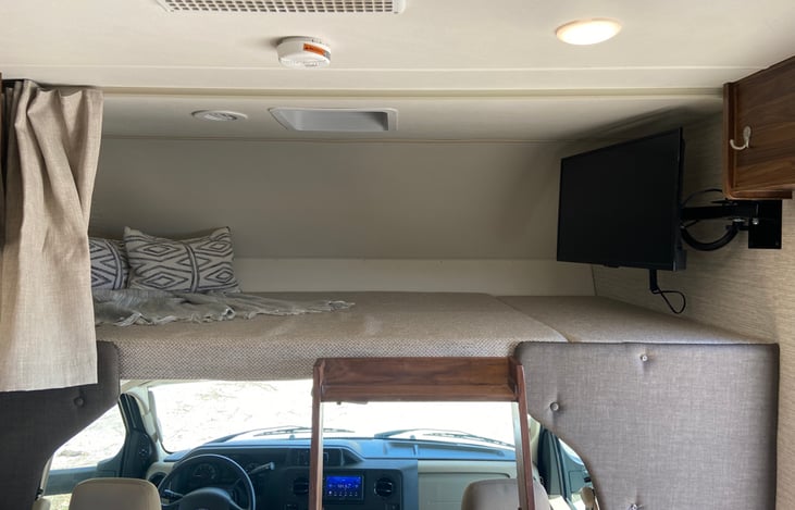 Overhead sleeping area with second TV