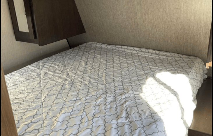 Queen size bed in bedroom