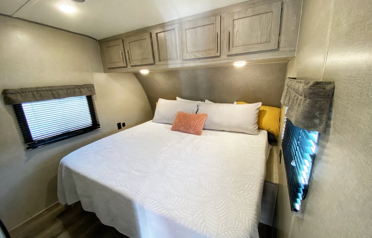 Front bedroom with King mattress with overhead storage and under bed storage