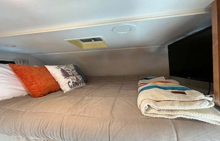 Over bunk bed with memory foam topper and bedding