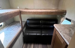 Camper with a queen living space and a bunkhouse.