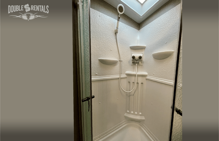 Upgraded Massaging Shower Head and Shelves in the Shower Feel Just Like Home