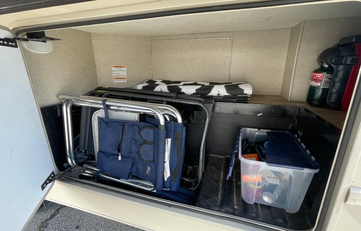 Camping chairs, outdoor rug, bug spray, etc.