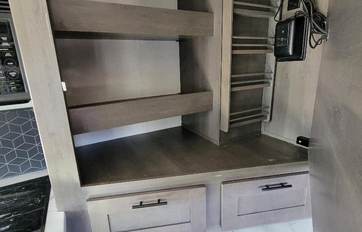 Storage pantry behind TV