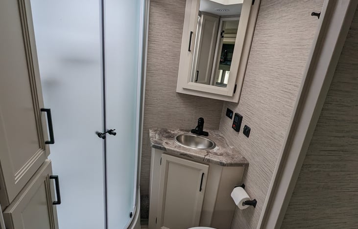 Complete bathroom with a tankless hot water system, you won't run out of hot water no matter how much fun the kids have.