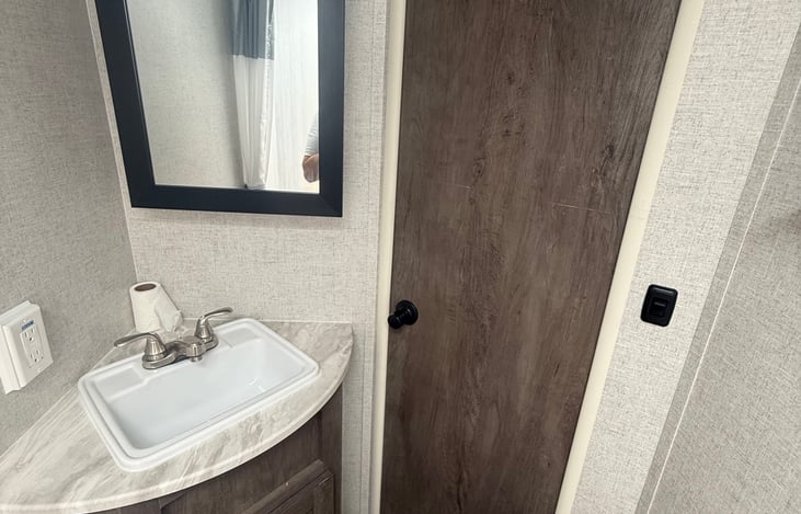 Great size bathroom, with medicine cabinet and under sink storage! Fully stocked with RV grade toilet, paper, towels and more!