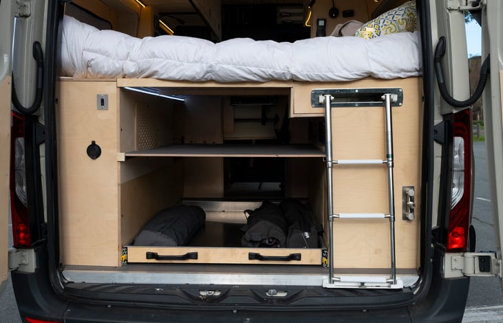 rear of van with ladder for easy access to platform bed from rear
