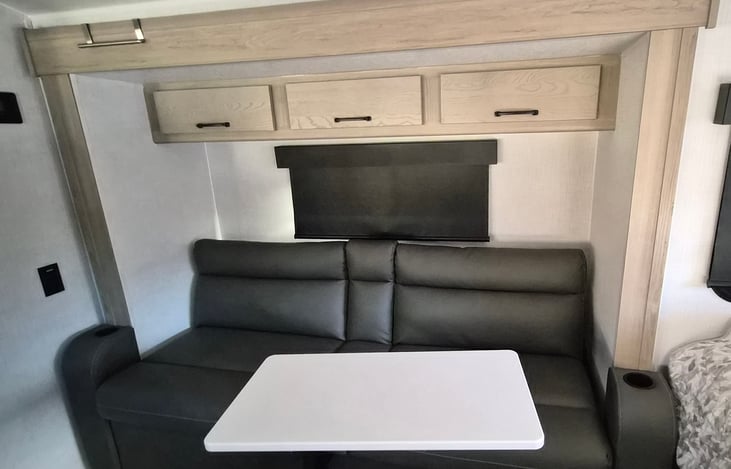 small removeable table that connects to couch if desired.