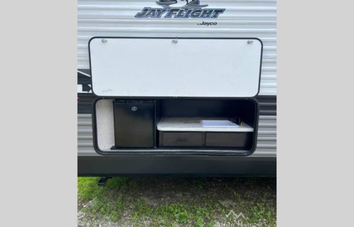 Outside mini fridge and sink